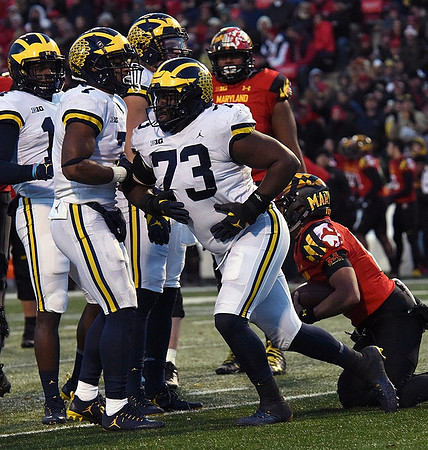 Khaleke Hudson (7) and Maurice Hurst (73)