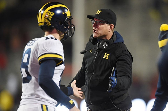 Brandon Peters (18) and Jim Harbaugh
