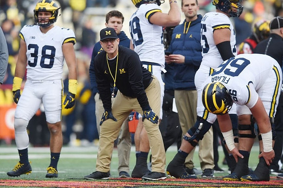Jared Wangler (38), Jim Harbaugh, and Chuck Filiaga (66)