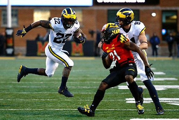 Karan Higdon (22) and Nate Schoenle (81)