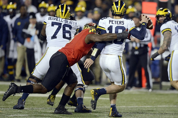 Juwann Bushell-Beatty (76) and Brandon Peters (18)