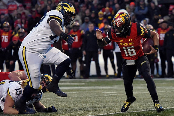 Chase Winovich (15) and Maurice Hurst (73)
