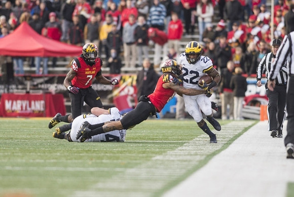 Ben Bredeson (74) and Karan Higdon (22)