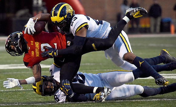 Tyree Kinnel (23) and Brandon Watson (28)