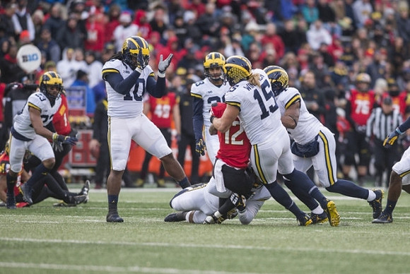 Tyree Kinnel (23), Devin Bush (10), Brandon Watson (28), Chase Winovich (15), and Khaleke Hudson (7)