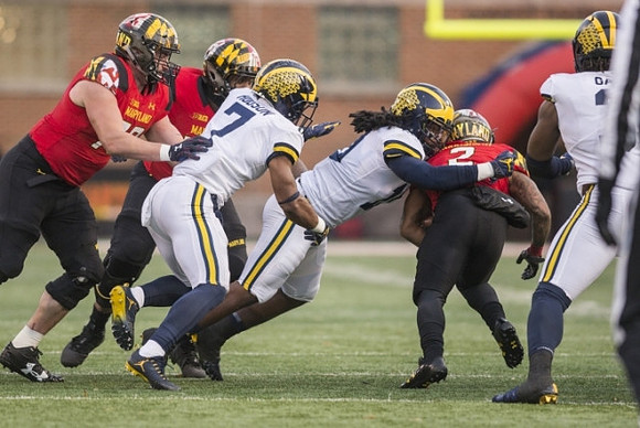 Khaleke Hudson (7), Devin Bush (10), and Rashan Gary (3)