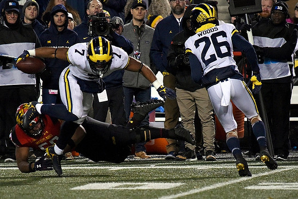 Khaleke Hudson (7) and J'Marick Woods (26)