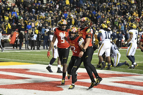 Devin Bush (10), Brandon Watson (28), and Khaleke Hudson (7)