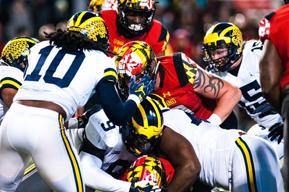 Devin Bush (10), Mike McCray (9), Maurice Hurst (73), and Chase Winovich (15)