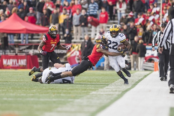 Ben Bredeson (74) and Karan Higdon (22)