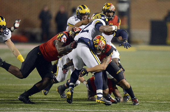 Zach Gentry (83), Chris Evans (12), and Ben Bredeson (74)