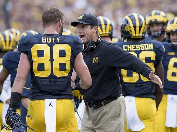 Jake Butt (88), Jim Harbaugh, and Jehu Chesson (86)
