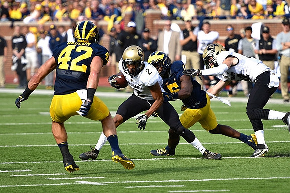 Ben Gedeon (42) and Jabrill Peppers (5)