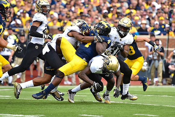 De'Veon Smith (4) and Jake Butt (88)
