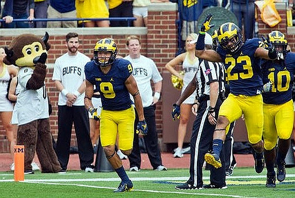 Grant Perry (9), Tyree Kinnel (23), and Devin Bush (10)