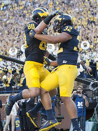 Jake Butt (88) and Ty Isaac (32)