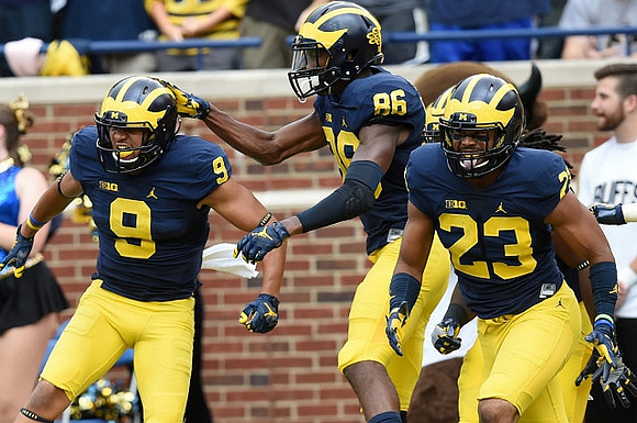 Grant Perry (9), Jehu Chesson (86), and Tyree Kinnel (23)