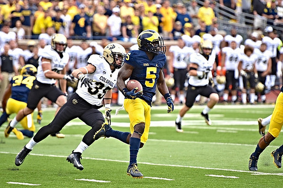 Jeremy Clark (34) and Jabrill Peppers (5)