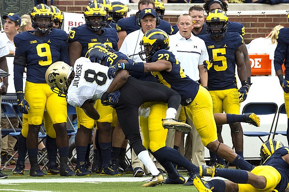 Josh Uche (35) and Tyree Kinnel (23)