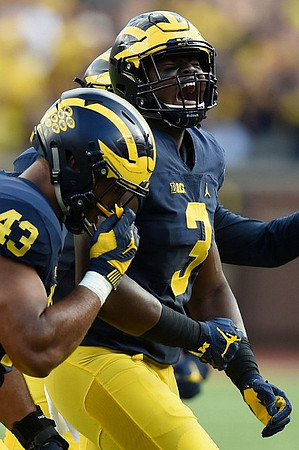 Chris Wormley (43) and Rashan Gary (3)
