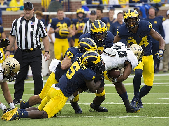 Ben Gedeon (42), Jabrill Peppers (5), and Jeremy Clark (34)