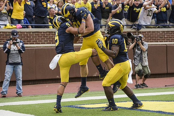 Grant Perry (9) and Devin Bush (10)