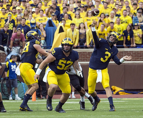 Jake Butt (88), Mason Cole (52), and Wilton Speight (3)