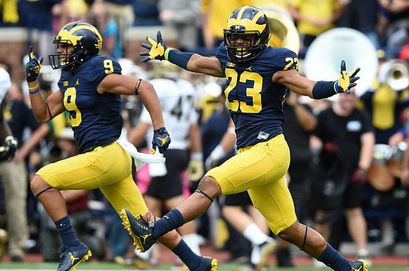 Grant Perry (9) and Tyree Kinnel (23)