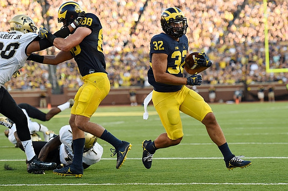 Jake Butt (88) and Ty Isaac (32)
