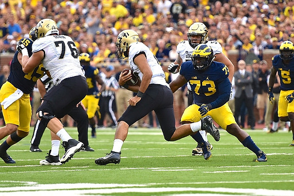 Chase Winovich (15), Maurice Hurst (73), and Jabrill Peppers (5)