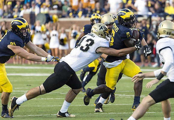 Michael Jocz (81) and Jabrill Peppers (5)