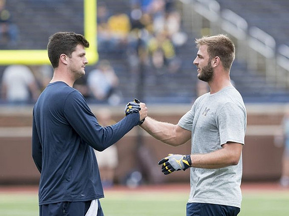 Wilton Speight (3) and Jake Butt (88)