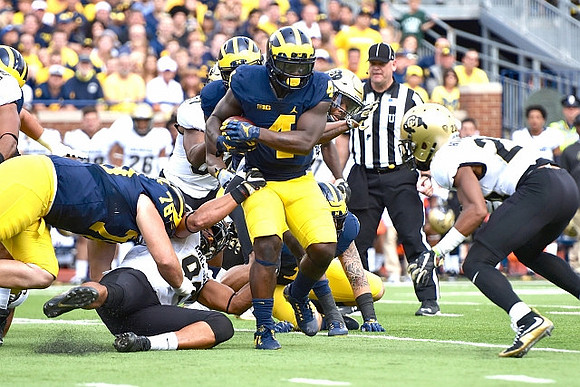 Erik Magnuson (78) and De'Veon Smith (4)