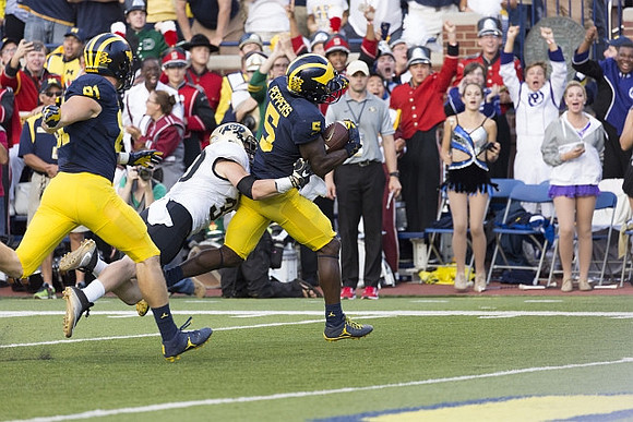 Michael Jocz (81) and Jabrill Peppers (5)