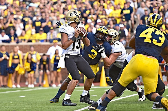 Rashan Gary (3) and Chris Wormley (43)