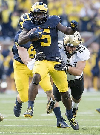 Michael Jocz (81) and Jabrill Peppers (5)