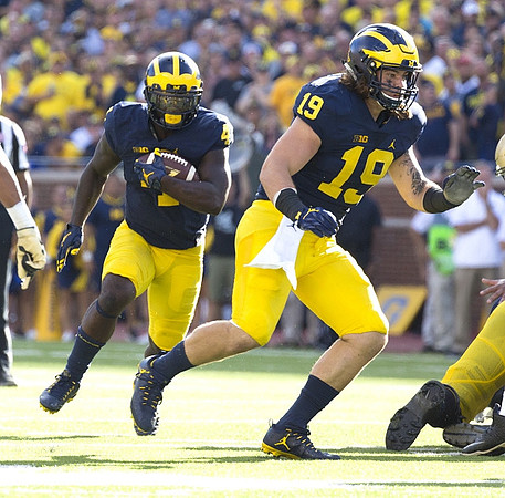 De'Veon Smith (4) and Henry Poggi (19)