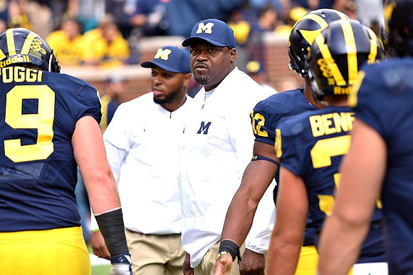 Henry Poggi (19) and Tyrone Wheatley Sr.