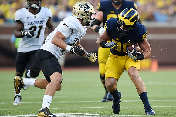 Kyle Kalis (67) and Jake Butt (88)