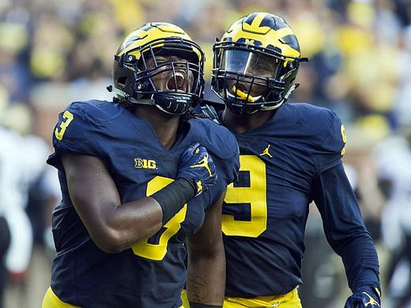 Rashan Gary (3) and Mike McCray (9)
