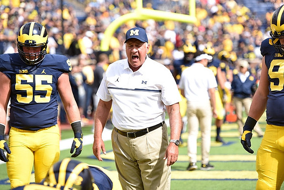 Garrett Miller (55) and Greg Mattison