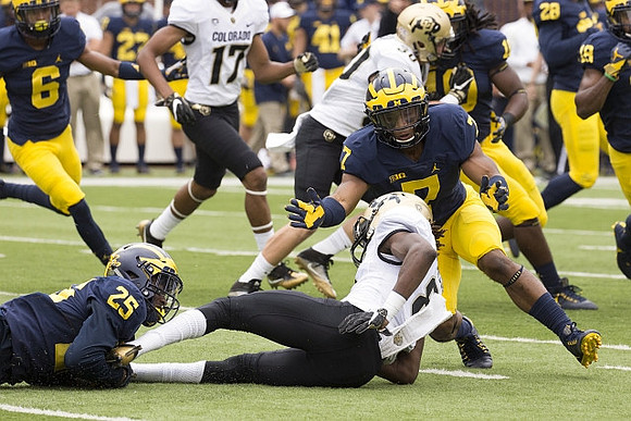 Keith Washington (6), Dymonte Thomas (25), Khaleke Hudson (7), and Devin Bush (10)