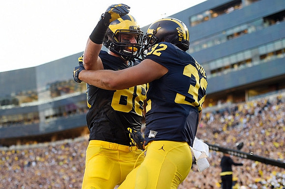 Jake Butt (88) and Ty Isaac (32)