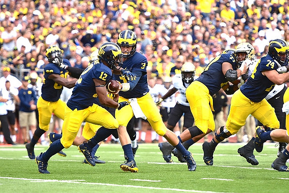 Khalid Hill (80), Chris Evans (12), Wilton Speight (3), Grant Newsome (77), and Ben Bredeson (74)