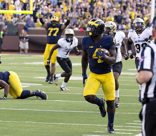 Grant Newsome (77) and De'Veon Smith (4)
