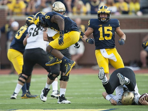 Jabrill Peppers (5) and Chase Winovich (15)