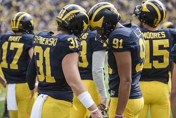 Will Hart (17), Scott Sypniewski (31), Kenny Allen (91), and Garrett Moores (15)
