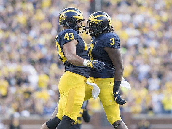 Chris Wormley (43) and Rashan Gary (3)