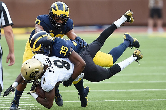 Tyree Kinnel (23) and Josh Uche (35)