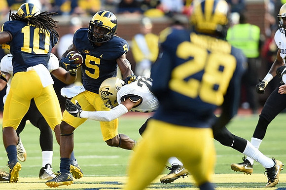 Devin Bush (10), Jabrill Peppers (5), and Brandon Watson (28)